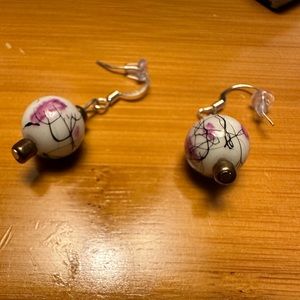 Purple and white dangly earrings